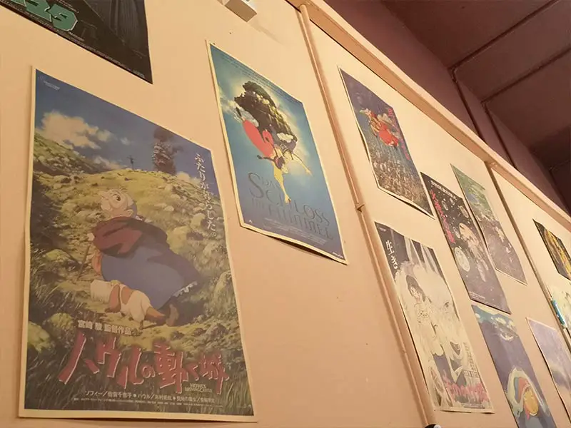 anime-poster-decor-on-the-wall-of-yamatatsu-cafe