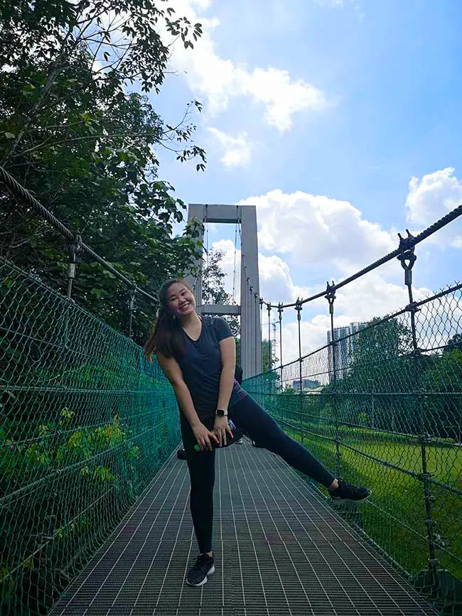 valerie posing on the suspension steel bridge of bukit gasing