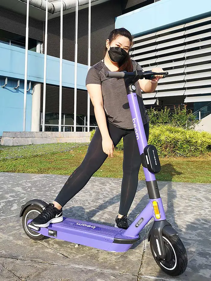 valerie-posing-with-beam-scooter
