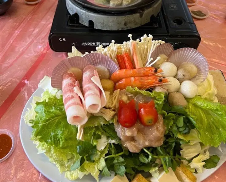 fresh steamboat ingredients just ready to be cooked in the hot soup broth