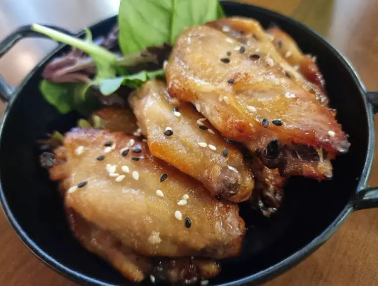 chicken wing in a mini wok served at miam miam bugis japanese food