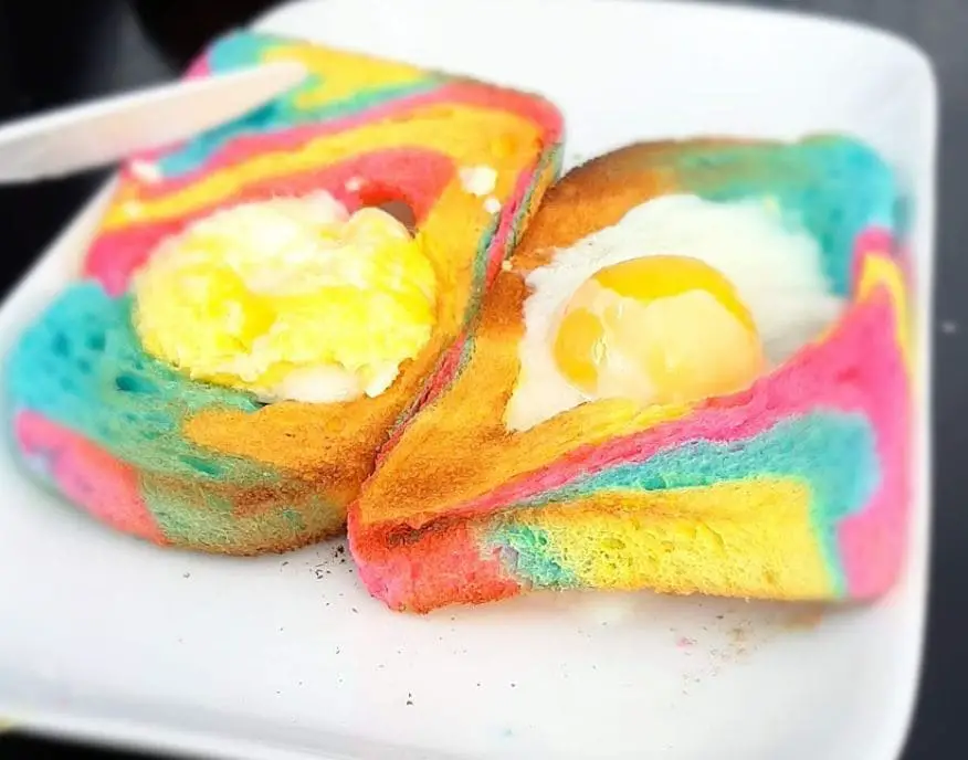 rainbow bread with sunny side up egg at opah strawberrie and jams for breakfast