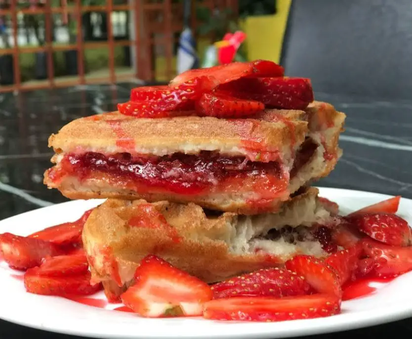 strawberry waffles with fresh strawberry cuts in agro highlands cafe