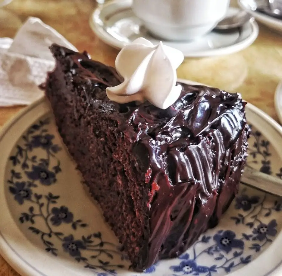 wholesome chocolate cake with a whipping cream top fulfiles the breakfast desires of anyone who visit lord cafe