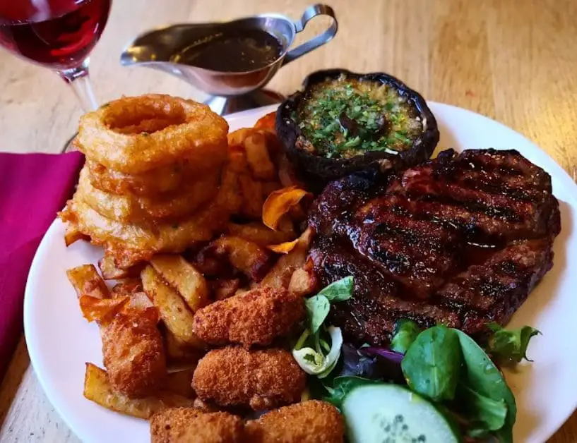emily steakhouse sirloin steak with nuggets wine mushrooms fries and salad