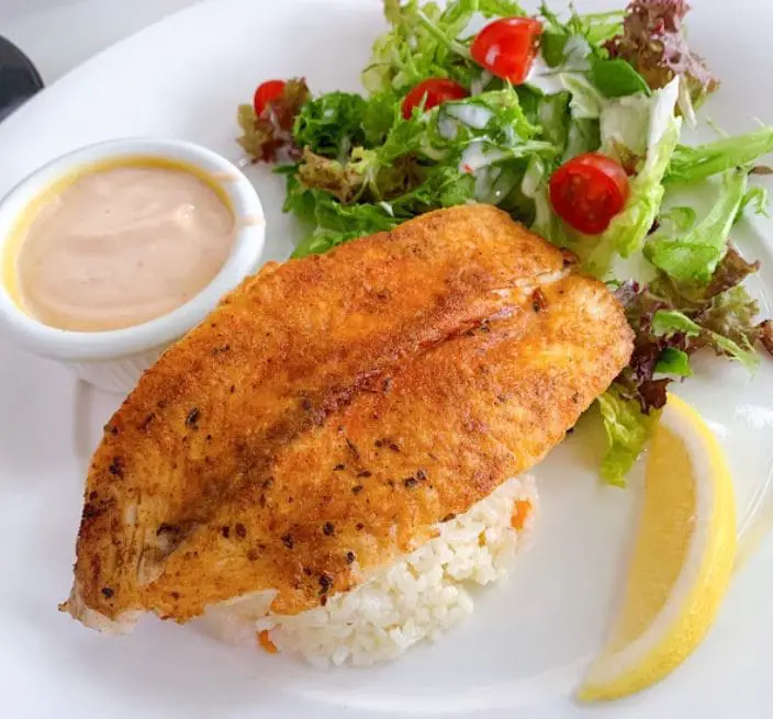fish with rice and salad greens by harvest in cafe western food penang
