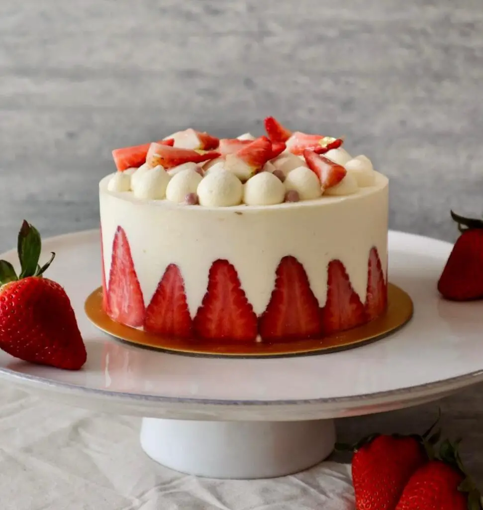 strawberry cake on a platter by baker and cook cake shop in bugis