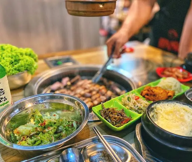 customer grilling meat at super star k kbbq tanjong pagar