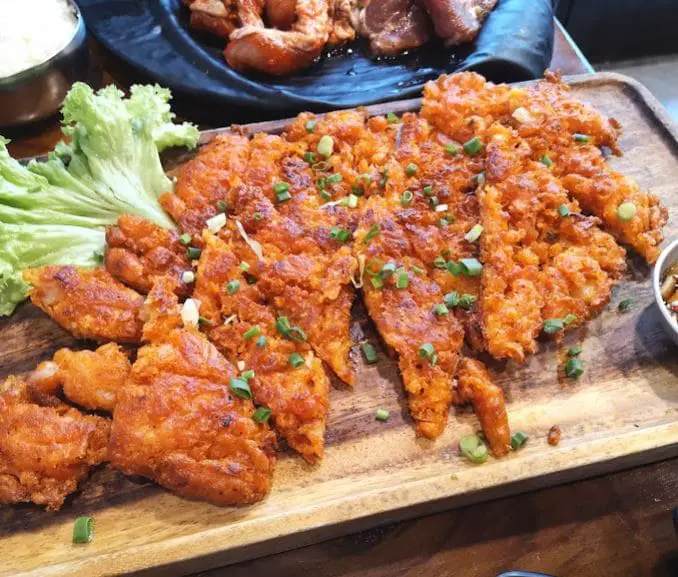 cut meat on a wooden board at mimi korean bbq restaurant tanjong pagar