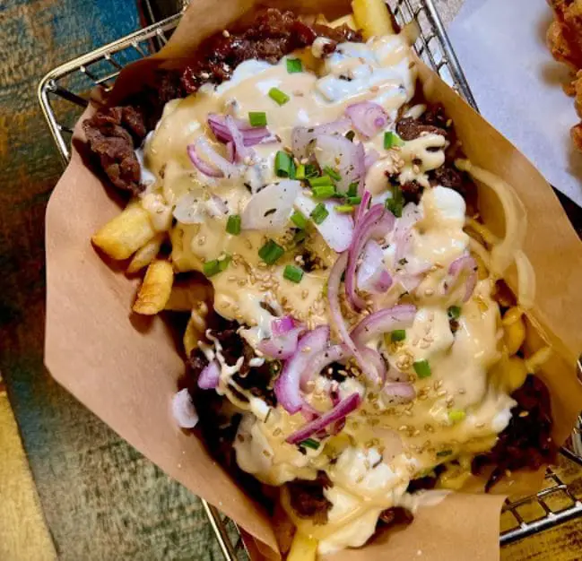 fried chicken with fries and onion cheese sauce at chicken up tanjong pagar