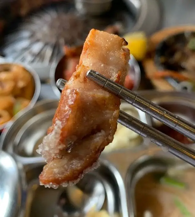 grilled pork dipped in salt at super star k korean bbq restaurant in tanjong pagar