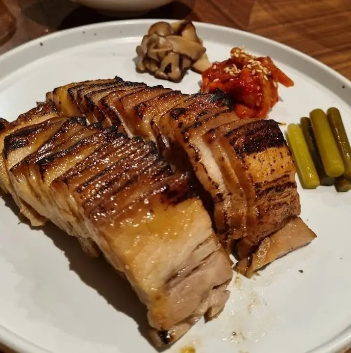 plate of beautiful grilled pork served at anju korean food in tanjong pagar