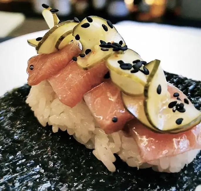 salmon sushi roll with seaweed at rappu handroll bar