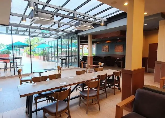 ambiance of interior seating of starbucks batu ferringhi with sunroof