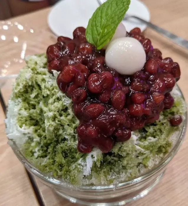 matcha ice flakes with red bean topping served at belle ville pancake cafe in tanjong pagar