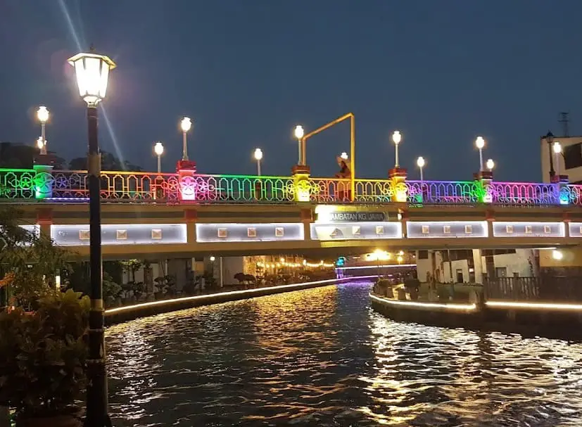 rainbow lighted bridge at malacca river