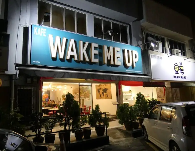 bold sign board of Kafe Wake Me Up