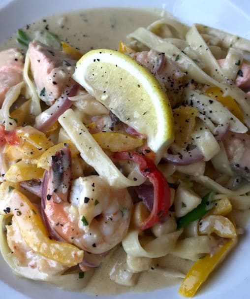 creamy carbonara loaded with seafood from Casa Americo Italian Bistro & Restaurant