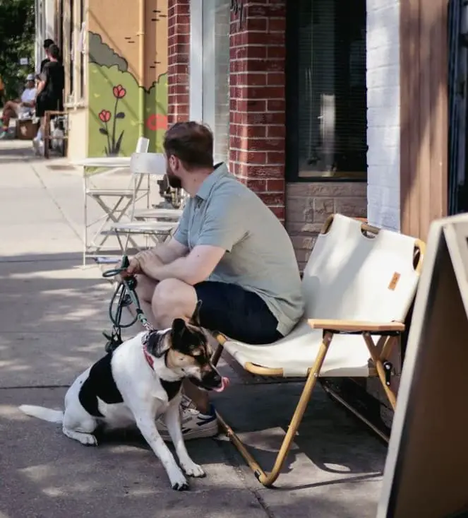 dog and owner at outside seat of 135 ossington cafe