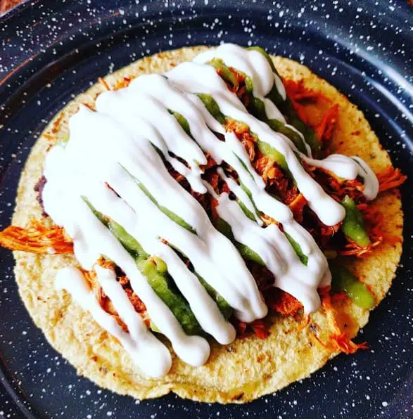loaded sauce on a tortilla by Campechano Adelaide mexican restaurant in toronto