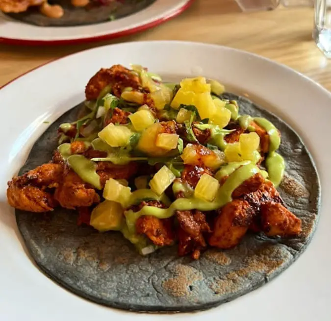 mexican chicken and salsa sauce on a black tortilla at Campechano Adelaide