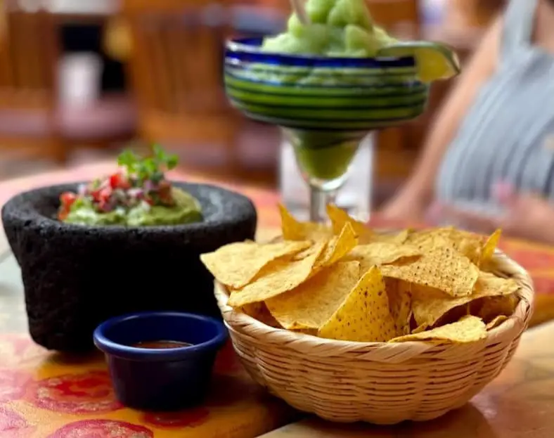nachos and bowl of dips from Mariachi's Restaurant Mexican Cuisine
