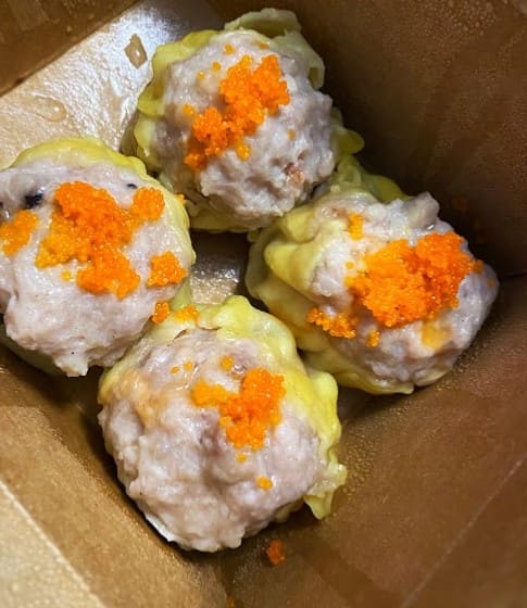 siew mai in a take out box from Mean Bao