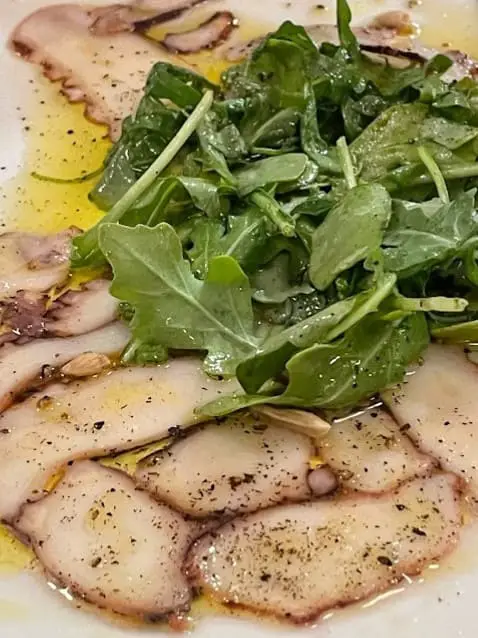 sliced octopus italian dish from Claudio's