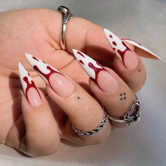 blood dripping white fang nails