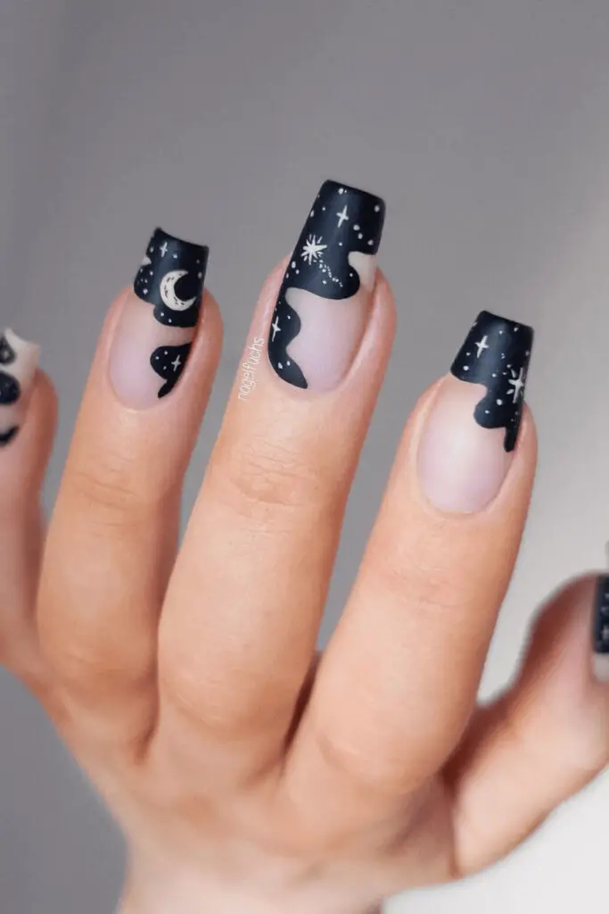 dipped in night sky of halloween nails