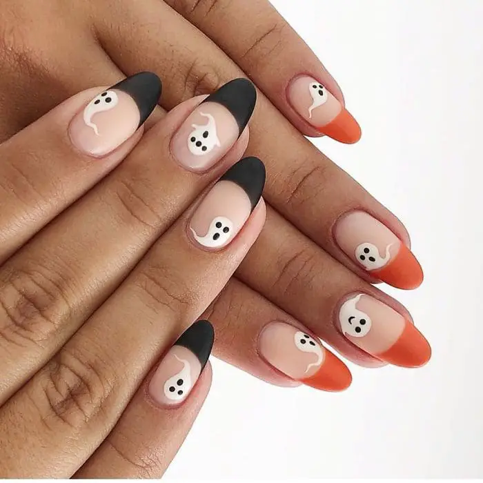 dipped orange black ghost nails
