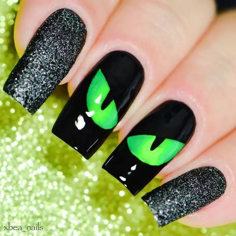 green cat eye halloween nails