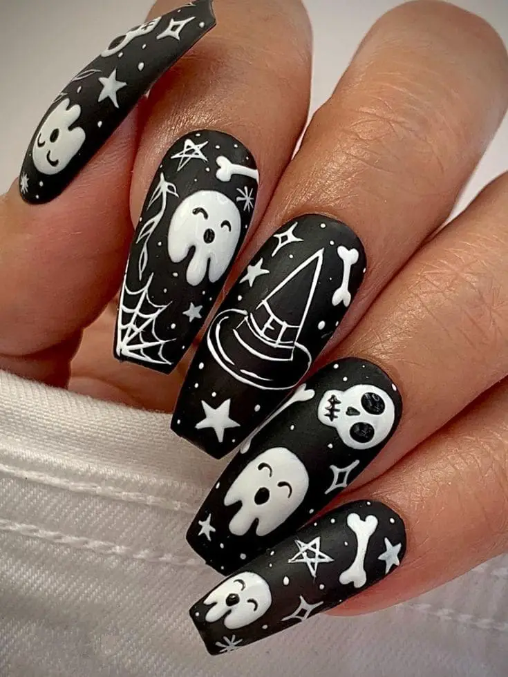 happy ghost and skulls over night sky nails