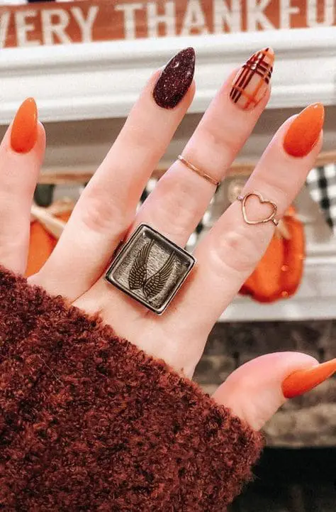 modern orange halloween themed nails
