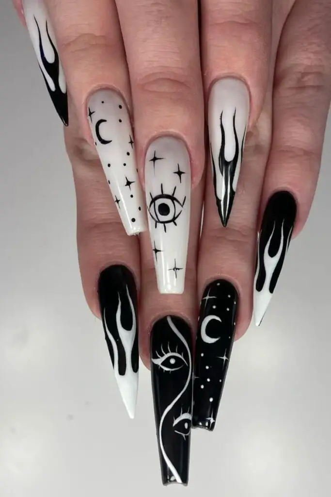 symbols and dark night sky nails