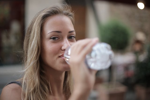 Hydrating your body by drinking enough fluids is an excellent way to take care of your skin, including your lips